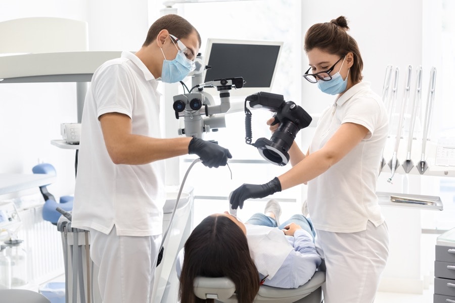 Dentist taking dental photographs of a patient